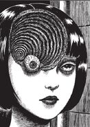 The iconic transformation of Azami's crescent-shaped scar into a black hole. This particular panel is one of the most famous examples of Junji Ito's illustrations in all of his works.