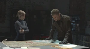 Ana and Konstantin watch a map of the mountains