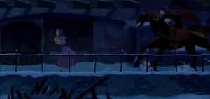 Frollo chasing after the helpless gypsy woman down the streets of Paris.