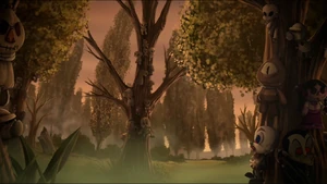 Several dolls placed in different trees of the swamp.