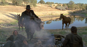 "Wake up! I got me a runt to kill!"- Tannen wakes up his gang.