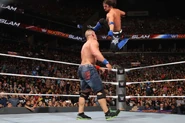 AJ Styles hitting Cena with the Phenomenal Forearm.