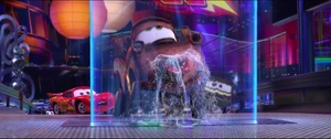 Axlerod watching Mater drink from a fountain after the latter tasted wasabi.