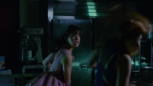 After being stabbed by Liz, Megan knocks out Heather.