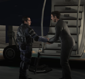 Becker, in full tactical gear, shaking Victor's hand before he gets on the plane.