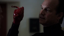 Garrett killing General Jacobs, horrifying everyone around them.