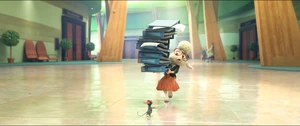 At City Hall, Bellwether tries to get Lionheart to review some documents she's carrying in binders.