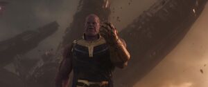 Thanos attempting to close his fist.