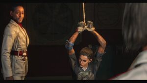 Castillo speaks to Diego while torturing Dani.