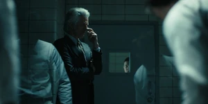 Brenner being spied on by Eleven.