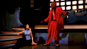 Sweet changing the color of his suit from red to blue.