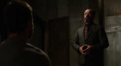 Anatoly speaks to the captured Oliver