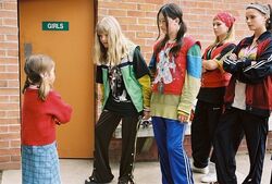 Janice and her friends taunt May Belle Aarons.