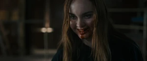 Quinn's psychotic evil grin as she walks slowly to kill Sam while she holding Tara with Ethan backing them into a corner.