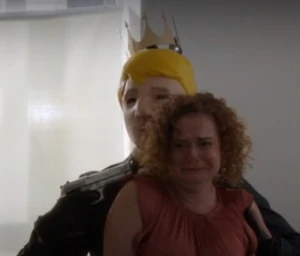 Williams holding Vivian at gunpoint.