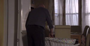 Phil Mitchell babysitting his infant child Albie Watts.
