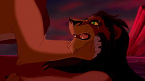 Simba chokes Scar into revealing that he killed Mufasa.