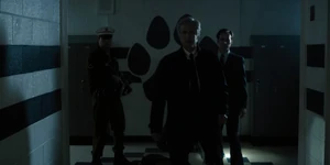 Brenner finding the kids in one of the school's hallways.