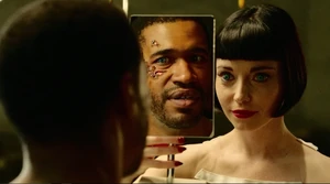 BloodDriveMirror.jpg (142 KB) Aki shows Chris his new eye.