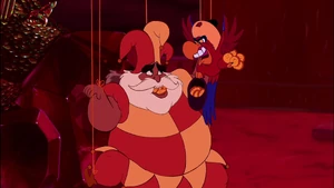 Iago torturing the Sultan by shoving crackers into his mouth.