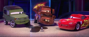 Axlerod stares angrily at Mater as he keep pretending to be disgusted with him after leaking oil.