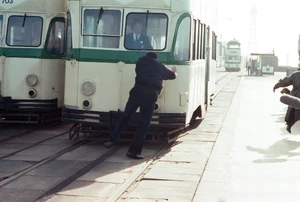 Alan runs onto an incoming tram which ends up hitting him, consequently killing him as a result.