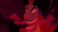 Jafar evilly laughing after surrounding Aladdin with flames.