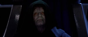 Close-up view of Emperor Palpatine on his throne.