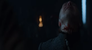 Arya slashing Petyr's throat with his own dagger, ending his cruel life.