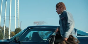 Billy getting into his car after picking Max up from school.