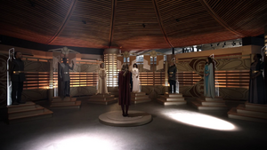 Selena (in white) alongside the High Council of Argo.