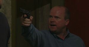 Phil demands Dan to tell him where Mel is hiding (2001).