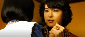 Kyeong-suk brutalizes Jung-Soon.