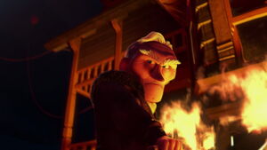 Muntz setting fire to Carl's house.