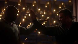 Pierce fighting Amenadiel for giving him his mark.