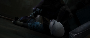 Ventress collapses and the hooded figure removes the former assassin's lightsabers and picks up her fallen helmet.