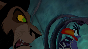 Scar threatening Zazu for mentioning Mufasa's name in his presence.