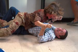 Patriot wrestling and attacking Clint
