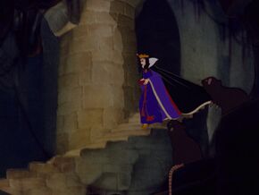 Queen Grimhilde descending down a staircase.