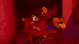 Iago struggling to break free from Abu's grip.