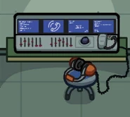 Burt's headphones in the communications room in Among Us