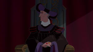 Frollo ignores Quasimodo's pleas as he is tortured by the crowd as punishment for disobeying him