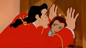 Gaston attempting to grope an uncomfortable Belle, who rejects his proposal.