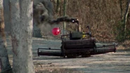 The Lawnmower charging towards Roy and Kelly