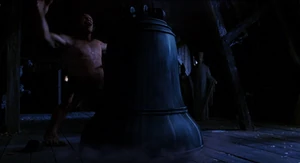 Mr. Hyde grabbing the huge bell, rips it off its moorings and slams it down over Van Helsing, trapping him inside.