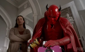 The Red Devil pouring hydrochloric acid in Melanie's spray tan machine under Hester's orders.