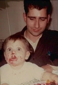 Dickie with his infant son Christopher.