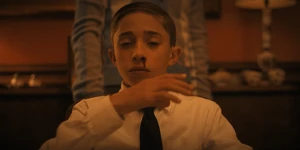 A young Henry bleeding from his nose after using his powers to murder his mother.