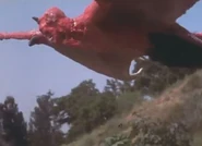 Asmodeus flying through the sky before killing Vicki.