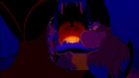 Jafar and Iago watching Gazeem approaching the Cave of Wonders.
